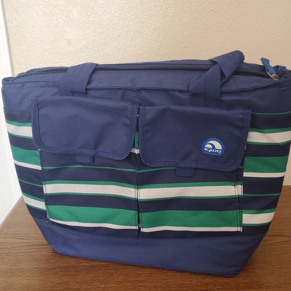 A blue, white, and green striped soft pack igloo.